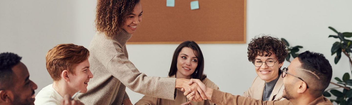 Business partners shaking hands after agreeing a wholesale supply partnership